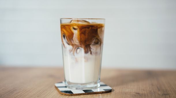 What are some popular additions to Enhance the flavor of iced coffee made with the Clever Dripper?